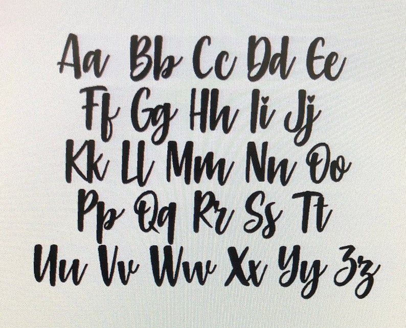 May include: Black cursive alphabet letters A to Z, arranged in a grid. The letters are in a handwritten style, with a slight slant and varying stroke thickness. The background is plain white.