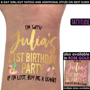 May include: Gold temporary tattoo with the text "I'm with Julia's 21st Birthday Party" and "If I'm lost, buy me a drink!"  The tattoo also includes a flamingo float with a pineapple and two champagne glasses.