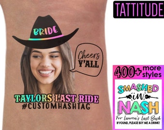 May include: A pink and black temporary tattoo with a bride wearing a cowboy hat and the text "Bride" on the hat. The tattoo also includes a speech bubble with the text "Cheers Y'all". The text "TATTITUDE" is in a pink box in the upper right corner. The text "TAYLORS LAST RIDE #CUSTOMHASHTAG" is below the bride. A pink and black box in the lower right corner says "SMASHED in NASH" with the text "For Lauren's Last Bash IF FOUND, PLEASE BUY ME A DRINK!" below. The text "400+ more styles" is above the pink and black box.