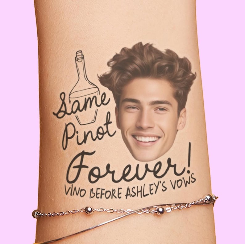 May include: A temporary tattoo featuring a smiling man's face and the words "Same Pinot Forever!" with a wine bottle illustration. The phrase "Vino Before Ashley's Vows" is also included. A silver bracelet is visible.