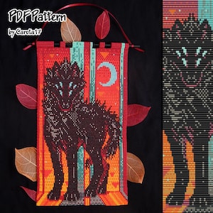 May include: A beaded wall hanging featuring a black wolf design against a vibrant orange and teal background. The artwork includes a crescent moon and the text "PDF Pattern by Carola17". The piece is adorned with red leaves and a red ribbon for hanging.