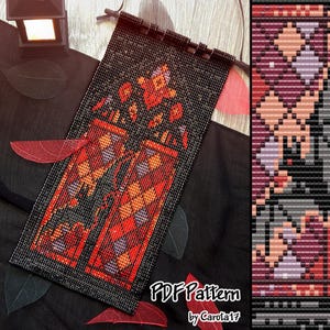 May include: A beaded wall hanging with a black backdrop and a geometric design in red, orange, and purple. The text "PDF Pattern by Carola17" is visible at the bottom. The hanging is suspended from a wooden rod.