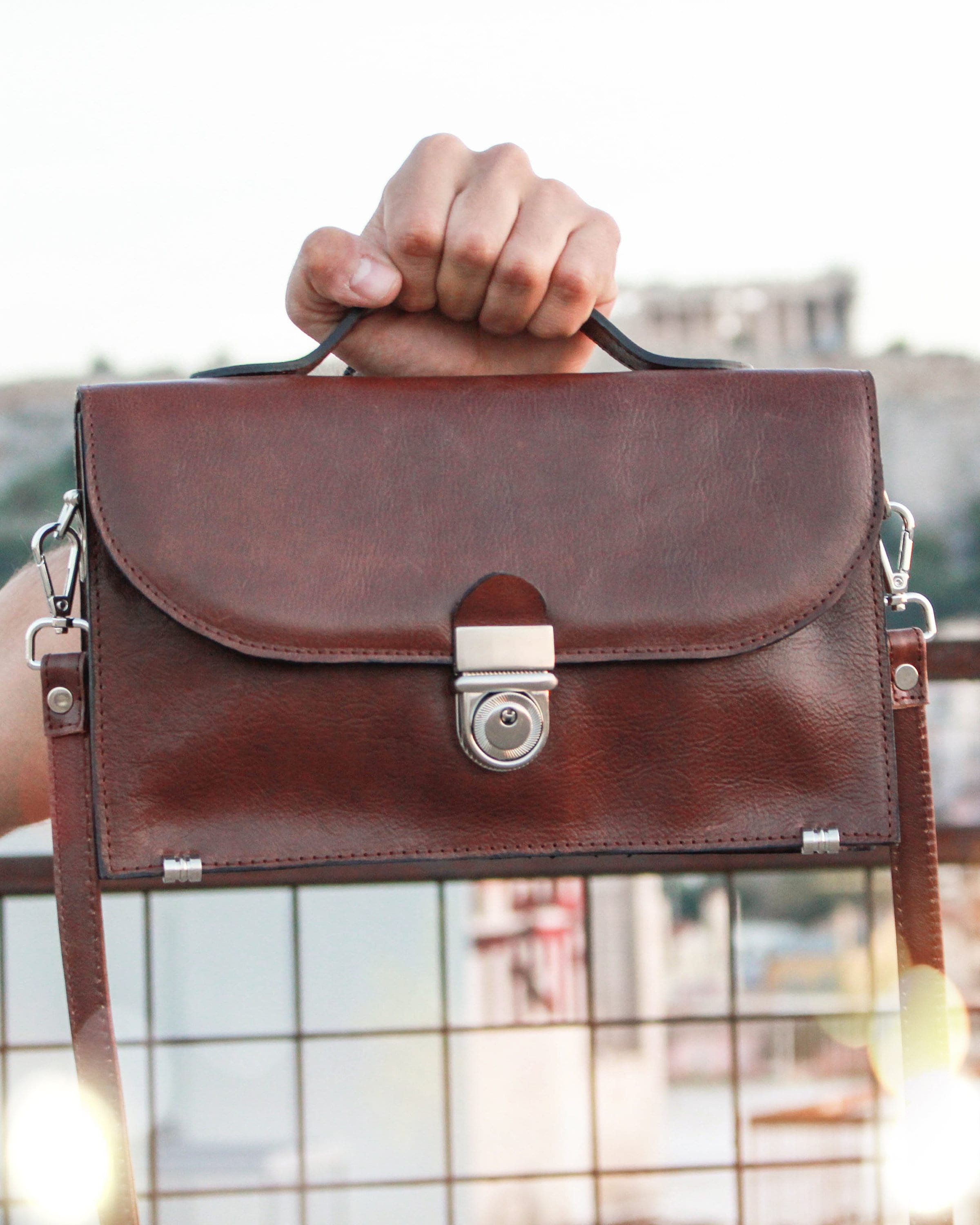 brown strap bag
