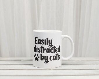Taza Distraído fácilmente por los gatos