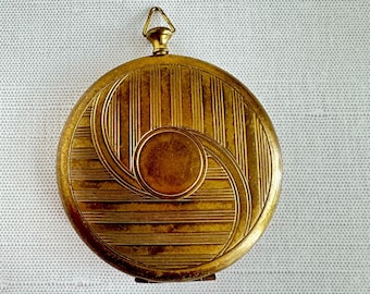 Colgante compacto estilo Art Déco de Zell Fifth Avenue de la década de 1930, tono dorado, estilo reloj de bolsillo.