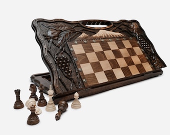 Handle chess. engraved chess board with pomegranates and grapes