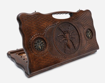 Handle backgammon. Luxury backgammon with engraving spider and bronze details