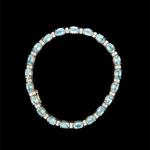 Vintage 13.92 Carat Blue Topaz & Diamond 14k Yellow Gold Tennis Bracelet