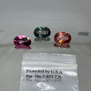 Mystic Fire Topaz Patented authentic Azotic 10x14 MM Oval