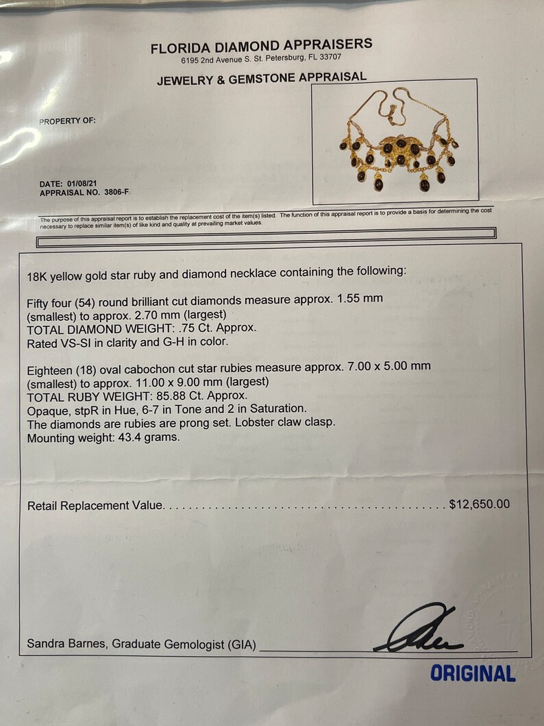 May include: 18K yellow gold star ruby and diamond necklace. The necklace features 54 round brilliant cut diamonds, 18 oval cabochon cut star rubies, and a lobster claw clasp. The total diamond weight is 75 carats and the total ruby weight is 85.88 carats. The diamonds are VS-SI in clarity and G-H in color. The rubies are opaque, 6-7 in tone and 2 in saturation. The mounting weight is 43.4 grams. Retail Replacement Value: $12,650.00. Sandra Barnes, Graduate Gemologist (GIA).