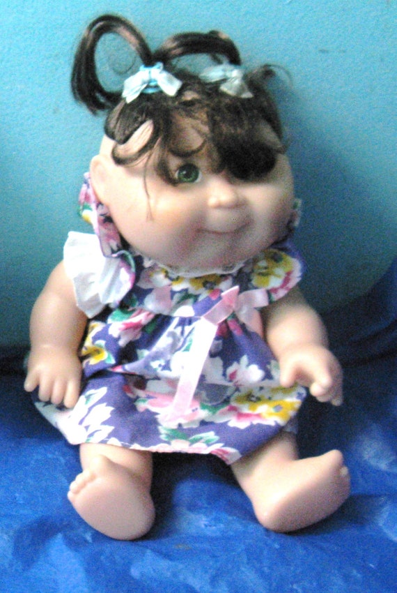 black cabbage patch doll with glasses