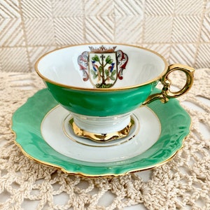 Vintage German porcelain teacup and saucer collector&#39;s PVB with city coat of arms Inlet Mainau 1272 Gold gilded (M)