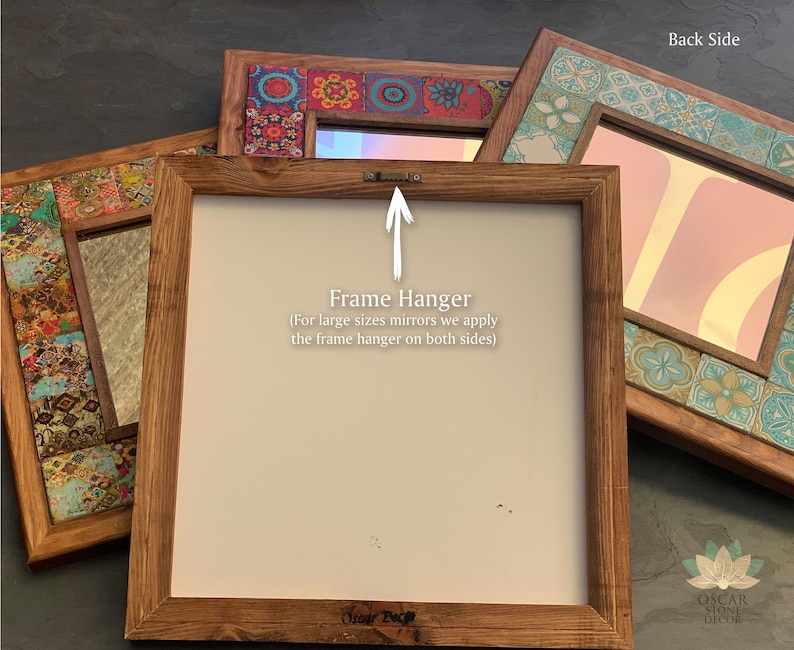 May include: Several decorative mirrors with wooden frames are displayed. The mirrors have colorful tile accents and are in various sizes. The back of one mirror shows a frame hanger. Text on the image reads "Frame Hanger" and "Back Side".