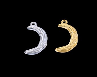 May include: Two crescent moon charms, one silver-colored and one gold-colored, against a black background. Each charm has a loop at the top for hanging and a textured surface. The charms are likely for jewelry making.