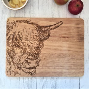 a cutting board with a picture of a cow on it