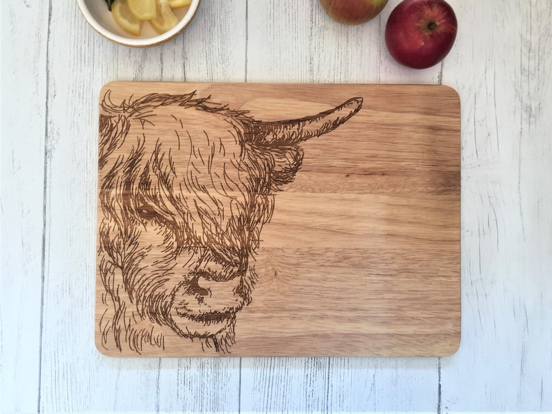 a cutting board with a picture of a cow on it