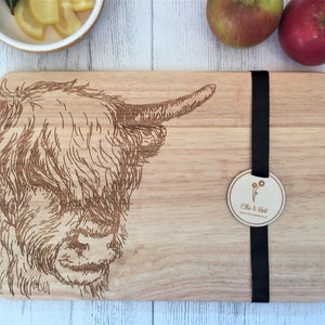 a cutting board with a picture of a cow on it