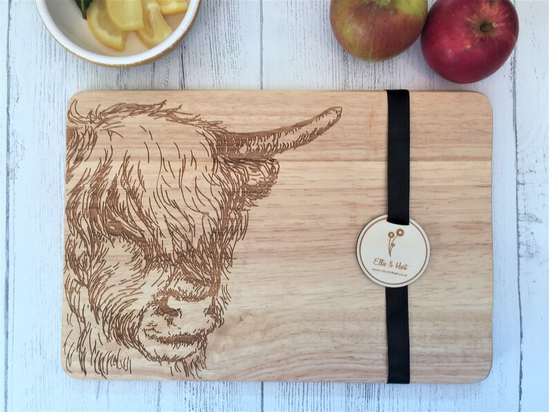 a cutting board with a picture of a cow on it