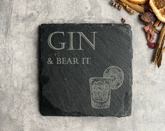 May include: Black slate coaster with the text "GIN & BEAR IT" and a drawing of a glass of gin with a lime wedge.