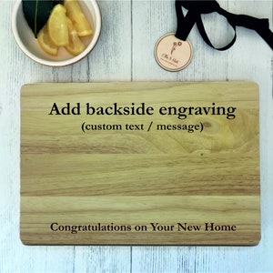 a cutting board with a name tag and a pair of glasses next to it