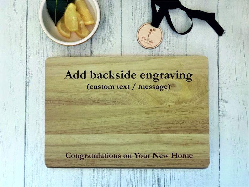 a cutting board with a name tag and a pair of glasses next to it