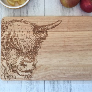 a cutting board with a picture of a cow on it