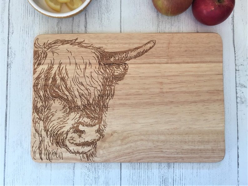 a cutting board with a picture of a cow on it