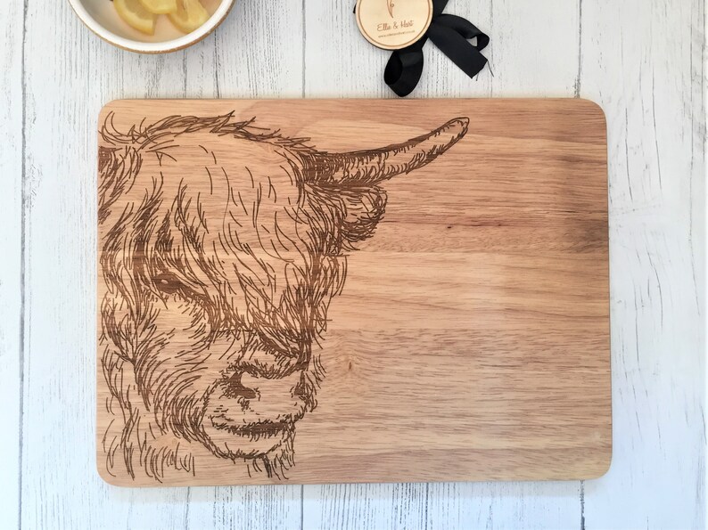a cutting board with a picture of a cow on it