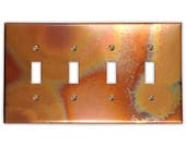 Quadruple Toggle Copper Switch Plate in Flamed