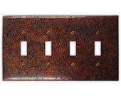 Quadruple Toggle Copper Switch Plate in Distressed Dark