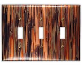 Triple Toggle Copper Switch Plate in Enchantment Vertical