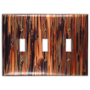 Triple Toggle Copper Switch Plate in Enchantment Vertical
