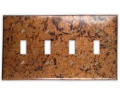 Quadruple Toggle Copper Switch Plate in Distressed Light