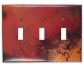 Triple Toggle Copper Switch Plate in Rojo y Negro