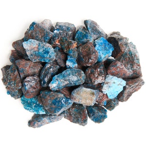 May include: A pile of blue and brown rough, raw, uncut, natural, tumbled, crystal, mineral, gemstone, rock, stones, or chips.