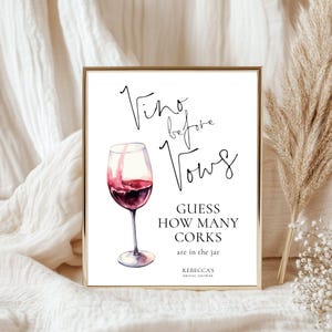 May include: A white sign with black text that reads "Vino before Vows" with a watercolor illustration of a glass of red wine. The sign also says "Guess how many corks are in the jar" and "Rebecca's Bridal Shower".