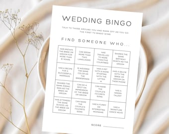 May include: A printable wedding bingo card with the title "Wedding Bingo" and the instructions "Talk to those around you and mark off as you go. The first to bingo wins." The card has a grid of 25 squares with different prompts for finding someone who matches the description.  For example, "Has known the bride or groom for more than 10 years", "Can speak more than two languages", "Has travelled to more than five countries", "Shares the same birthday month as the groom", "Has a recipe for a successful marriage", "Is wearing the same color as the bridesmaids", "Has a pet with a name starting with the letter M", "Has a selfie with the bride or groom on their phone", "Shares the same zodiac sign as the bride or groom", "Can do a spot-on impression of the bride or groom", "Can name the couple's favorite song", "Has a hidden talent", "Has attended the same school as the bride or groom", "Can name the couple's favorite song", "Has a funny or interesting nickname", "Has a signature dance move".
