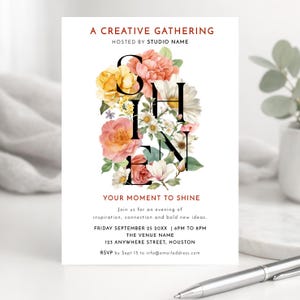 May include: White invitation card with the words "A CREATIVE GATHERING" and "YOUR MOMENT TO SHINE". The word "SHINE" is spelled out with black letters and filled with watercolor flowers in shades of pink, yellow, and white. Includes event details.