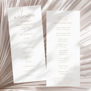 May include: A wedding ceremony program with a white background and gold text. The program lists the order of events for the ceremony, including the prelude, procession, bridal procession, opening prayer, readings, message, exchange of vows, kiss the bride, and recession. The program also includes a list of the wedding party, including the parents of the bride and groom, the maid of honor, best man, bridesmaids, groomsmen, flower girl, and ring bearer.