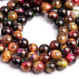 May include: A strand of round, multi-colored tiger's eye beads. The beads are a mix of gold, brown, red, and black with iridescent shimmer.