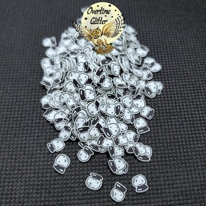 May include: A large pile of white and black crystal ball charms. The charms are made of plastic and have a flat back. The charms are perfect for adding a touch of whimsy to your crafts.