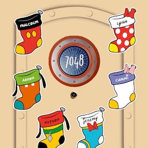 May include: Six decorative Christmas stockings featuring character-inspired designs with names Malcolm, Lynn, Aaron, Cammi, Hutson, and Jeremy. The stockings are arranged around a circular door sign displaying the number 7048 in a central blue emblem.