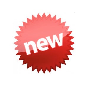 May include: A red starburst-shaped sticker with the word "new" in white letters.