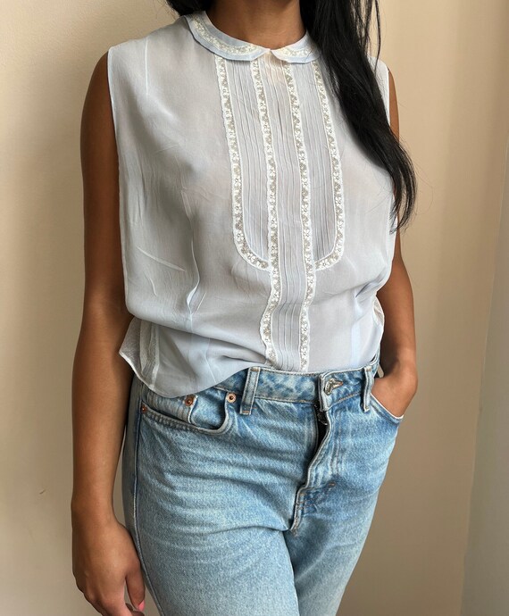 sleeveless pale blue chiffon top