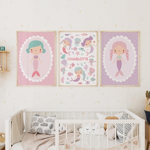 May include: Three pink and purple framed prints with illustrations of mermaids and the name Charlotte. The prints have a scalloped border and a white background.