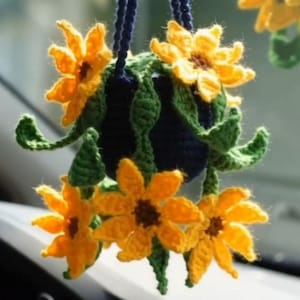 May include: A white ceramic mug with a black handle and the text "But First, Coffee" in a black, bold font. The mug is on a white surface. The mug is likely 11 ounces.