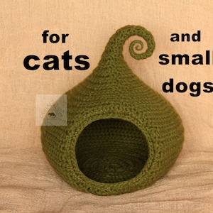 May include: A green crocheted pet bed shaped like a pod with a curled top. The text on the image reads "PATTERN for cats and small dogs". The bed has a circular opening and is designed for small pets.