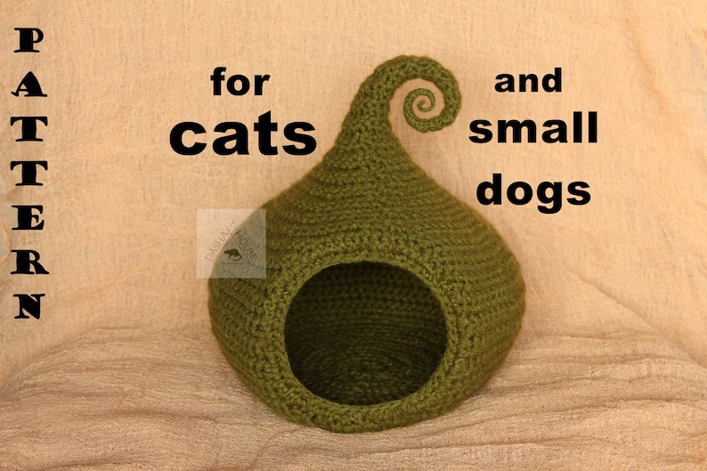 May include: A green crocheted pet bed shaped like a pod with a curled top. The text on the image reads "PATTERN for cats and small dogs". The bed has a circular opening and is designed for small pets.