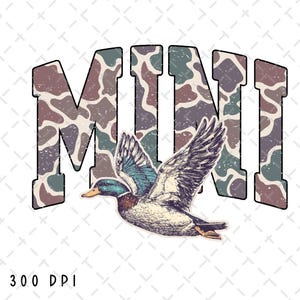 May include: A graphic design featuring the word "MINI" in a camouflage pattern with a distressed effect. Below the text is an illustration of a flying duck with detailed feathers and a colorful head. The background is white.