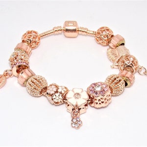 Bracelet with Pandora-style rose gold charms image 1